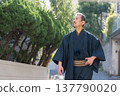 A man wearing a kimono 137790020