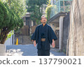 A man wearing a kimono 137790021