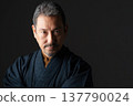 A man wearing a kimono 137790024
