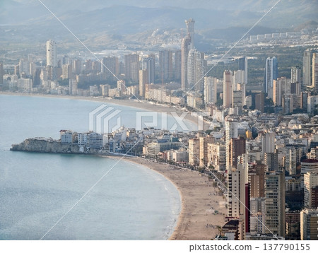 Beachfront Lively Scene, Bustling Coastal Street With Shops, Sunny Seaside Promenade Bustling With Activity Beachfront Lively Scene, Bustling Coastal Street With Shops, Sunny Seaside Promenade Bustling With Activity 137790155