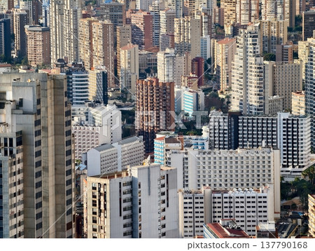 Dense Urban Structures, City Landscape Featuring Uniform Facades And Service Pathways Visible Dense Urban Structures, City Landscape Featuring Uniform Facades And Service Pathways Visible 137790168