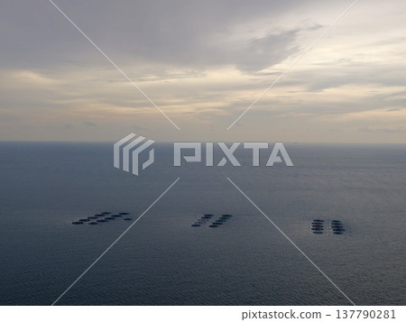 Birds Eye Perspective Of Peaceful Marine Cultivation Sites During Evening Hours With Soft Lighting Birds Eye Perspective Of Peaceful Marine Cultivation Sites During Evening Hours With Soft Lighting 137790281