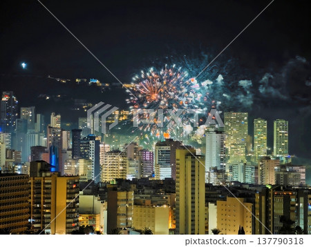 Spectacular Fireworks Display Over Towering Buildings Creates Festive And Energetic Urban Scene Spectacular Fireworks Display Over Towering Buildings Creates Festive And Energetic Urban Scene 137790318