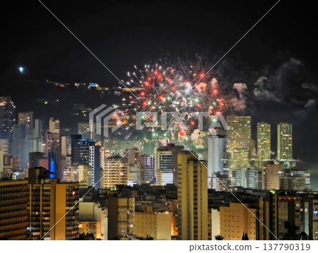 Colorful Fireworks Over City Skyline, Vivid Night Scene With Fireworks And Illuminated Buildings Colorful Fireworks Over City Skyline, Vivid Night Scene With Fireworks And Illuminated Buildings 137790319