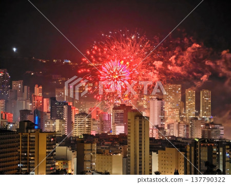 Night Skyline With Fireworks, City Skyline Glows With Spectacular Fireworks And Festive Ambiance Night Skyline With Fireworks, City Skyline Glows With Spectacular Fireworks And Festive Ambiance 137790322