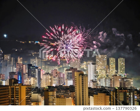 Spectacular Night View Showcasing Bursting Fireworks Over Harbor With Shimmering Reflections Spectacular Night View Showcasing Bursting Fireworks Over Harbor With Shimmering Reflections 137790326