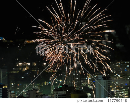 Spectacular Fireworks Illuminate Urban Sky With Multilayered Bursts And Sparkling Trails Across City Lights 137790348
