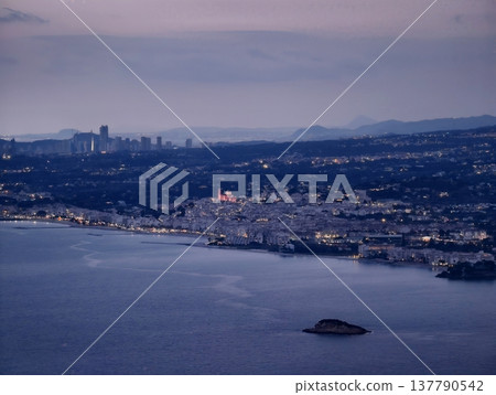 Gentle Evening Descends On Seaside City Featuring Distant Skyscrapers And Peaceful Harbor Ambiance Gentle Evening Descends On Seaside City Featuring Distant Skyscrapers And Peaceful Harbor Ambiance 137790542