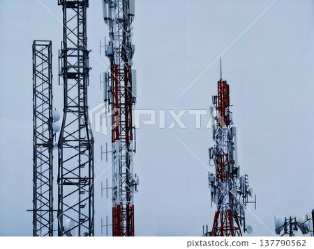 Dense Network Of Antennas, Industrial Skyline Filled With Communication And Transmission Equipment Dense Network Of Antennas, Industrial Skyline Filled With Communication And Transmission Equipment 137790562
