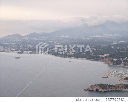 Serene Bay With Marina And Urban Scenery, Town Along Coast With Mountains And Harbor Atmosphere Serene Bay With Marina And Urban Scenery, Town Along Coast With Mountains And Harbor Atmosphere 137790581