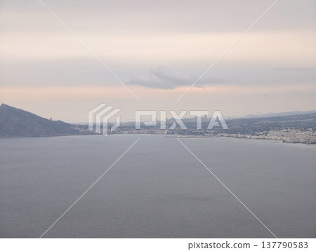 Calm Seaside Observation, Tranquil Coastal Scene Featuring Soft Clouds And Broad Shoreline Theme 137790583