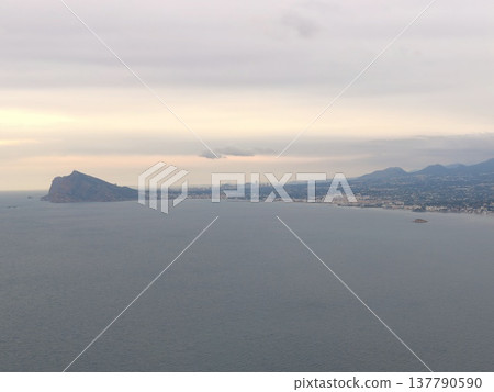 Bright Shore Surroundings, Vast Coastline Illuminated By Sun With Serene Atmosphere And Distant Hills 137790590