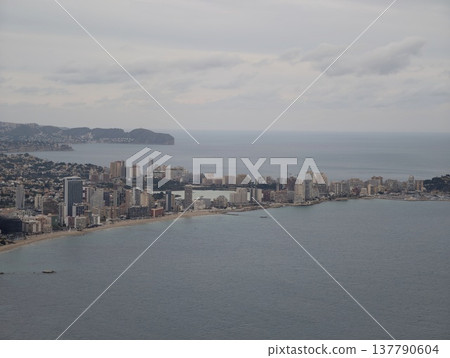 City Coastline With Distant Hills, Urban Seaside Scene With Dense Buildings And Overcast Sky Present City Coastline With Distant Hills, Urban Seaside Scene With Dense Buildings And Overcast Sky Present 137790604