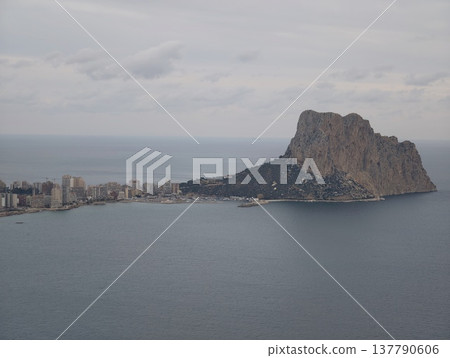 Cliff Face With Dramatic Sky, Majestic Solitary Stone Dominating Serene Seaside Landscape Views Cliff Face With Dramatic Sky, Majestic Solitary Stone Dominating Serene Seaside Landscape Views 137790606
