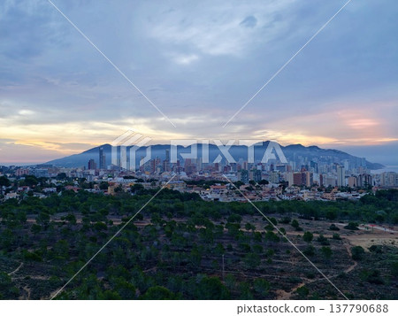 Tranquil Coastal Sunset View, Relaxing Sunset Paints Sky In Warm Colors Above Quiet Shoreline Community 137790688
