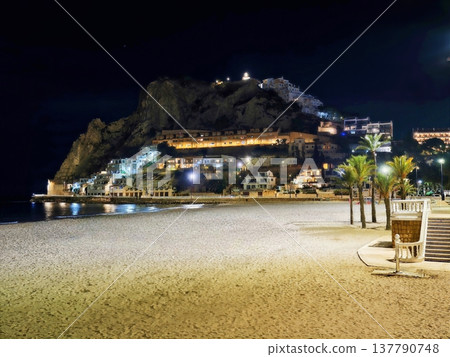 Calm Evening Escape, Quiet Night By Shore With Shining Cliffs And Empty Loungers Overlooking Sea Calm Evening Escape, Quiet Night By Shore With Shining Cliffs And Empty Loungers Overlooking Sea 137790748