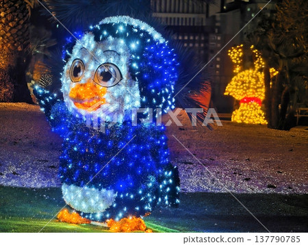 Whimsical Scene Featuring Cheerful Penguin Sculpture And Golden Dog Figure For Joyful Holiday Photos 137790785