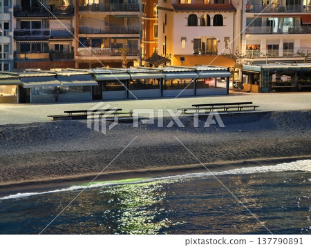 Silent Coast Benches By Water, Vacant Benches Along Shore By Shimmering Promenade At Sunset Silent Coast Benches By Water, Vacant Benches Along Shore By Shimmering Promenade At Sunset 137790891