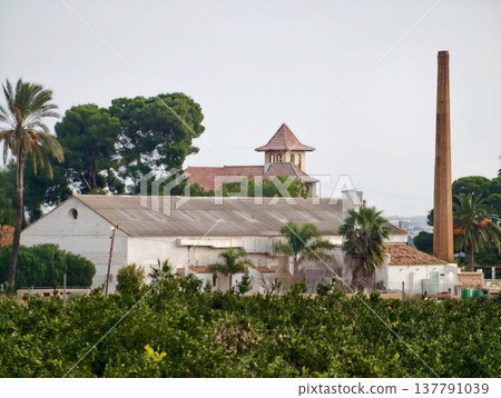 Countryside Industrial Harmony, Agricultural Roofs And Industrial Structures Contrast In Peaceful Countryside 137791039