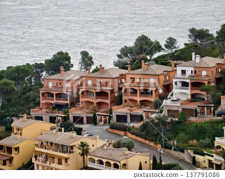 Sunlit Seaside Residential Area, Clustered Terracotta Residences With Ocean Views And Warm Facades 137791086