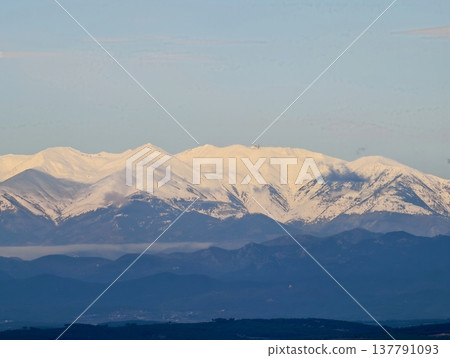 Golden Rays Warm Distant Summits, Bright Evening Rays Cast Warm Hue Over Distant Mountain Ridges Golden Rays Warm Distant Summits, Bright Evening Rays Cast Warm Hue Over Distant Mountain Ridges 137791093