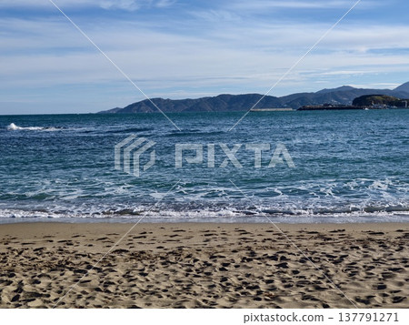 Serene Coast With Calm Waters, Calm Shoreline Scene Featuring Soft Clouds And Soothing Waves Serene Coast With Calm Waters, Calm Shoreline Scene Featuring Soft Clouds And Soothing Waves 137791271