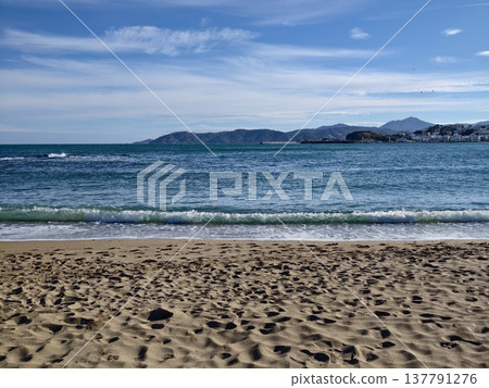 Tranquil Seaside View With Calm Waves, Peaceful Shoreline Showcasing Distant Island Under Clear Sky Tranquil Seaside View With Calm Waves, Peaceful Shoreline Showcasing Distant Island Under Clear Sky 137791276