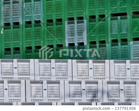 Warehouse Wall Featuring Systematically Stacked Plastic Crates In Vibrant Contrasting Colors 137791308
