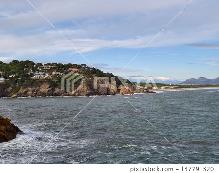 Peaceful Coastal Landscape Scene, Quiet Cliffside Harbor Surrounded By Greenery And Gentle Surf Peaceful Coastal Landscape Scene, Quiet Cliffside Harbor Surrounded By Greenery And Gentle Surf 137791320