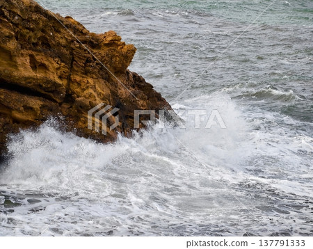 Sea Spray Collision, Unstoppable Ocean Force Unleashes Turbulent Spray And Foamy Waters On Sharp Rocks Sea Spray Collision, Unstoppable Ocean Force Unleashes Turbulent Spray And Foamy Waters On Sharp Rocks 137791333