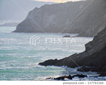 Rugged Shoreline Confronts Fierce Surf, Steep Cliffs And Churning Blue Waters Collide Passionately 137791560