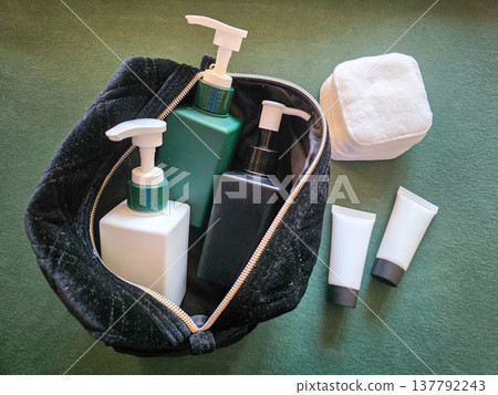 Colorful reusable containers for liquid cosmetic products in daily use on a textured background. Care products in a women's cosmetic bag. Skin care. Daily morning routine. High quality photo Colorful reusable containers for liquid cosmetic products in daily use on a textured background. Care products in a women's cosmetic bag. Skin care. Daily morning routine. High quality photo 137792243