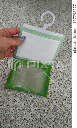 Hanging dehumidifier with hook for closet and wardrobe 137792277