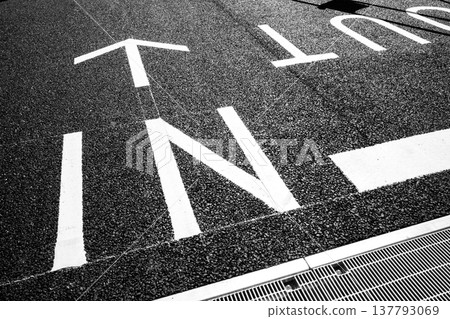 Brand new signage at the entrance/exit of a parking lot (a-5 monochrome) 137793069