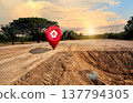 House symbol with location pin and Empty dry cracked swamp reclamation soil, land plot for housing construction project with and beautiful sunset sky with fresh air Land for sales landscape concept 137794305
