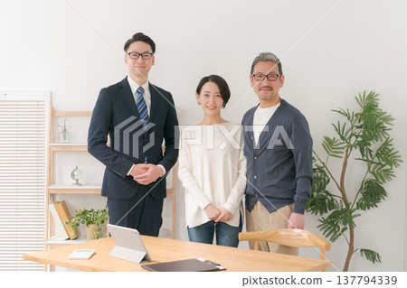 A smiling businessman and a middle-aged couple 137794339