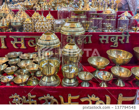 Collection of ornate brass incense burners, also known as "dhoop dani" or "incense holders. "  137794548