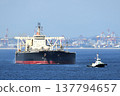 Crude oil tankers sailing under the escort of a patrol boat. 137794657