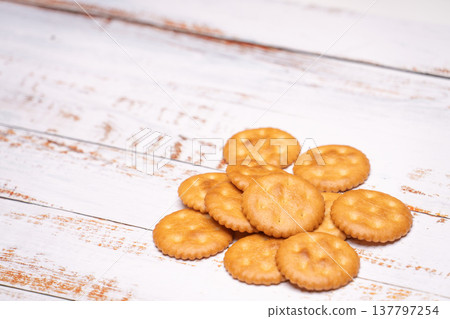 Grilled crackers lined up against a white background. Grilled crackers lined up against a white background. 137797254