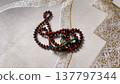 Prayer beads on the prayer mat 137797344