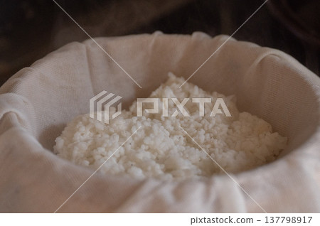 Steam frozen rice in a bamboo steamer. Steam frozen rice in a bamboo steamer. 137798917