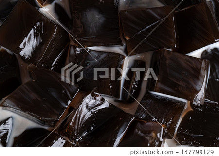 Black grass jelly in fresh milk, a refreshing Thai dessert in summer season Black grass jelly in fresh milk, a refreshing Thai dessert in summer season 137799129