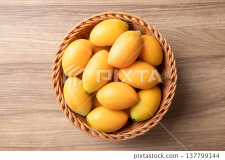 Fresh Marian plum (Mayongchid), Thai tropical fruit in summer season, Table top view 137799144