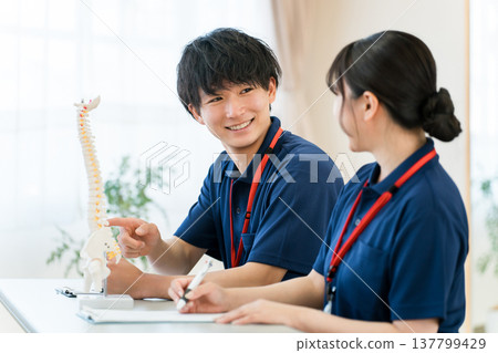 Male and female care workers and care managers receiving training (study group, meeting) 137799429