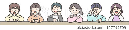 A boy and a girl smiling, leaning on the table with their elbows. A boy and a girl smiling, leaning on the table with their elbows. 137799709
