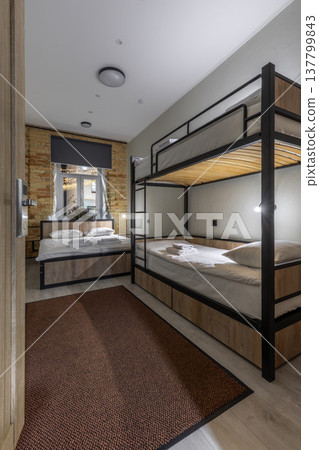 Modern Hostel Dormitory Room with Bunk Beds and Double Bed Modern Hostel Dormitory Room with Bunk Beds and Double Bed 137799843