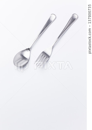 Metal spoon and fork on a white background 137800735