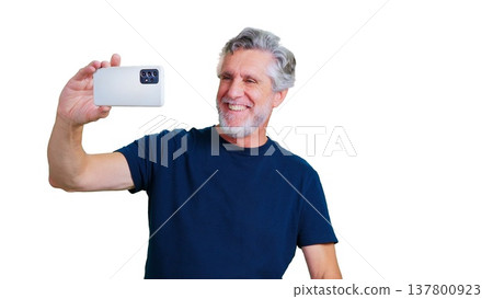 Senior man smiling taking selfie with smartphone 137800923