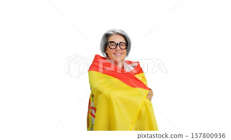 Senior woman smiling wrapped in Spain flag Senior woman smiling wrapped in Spain flag 137800936