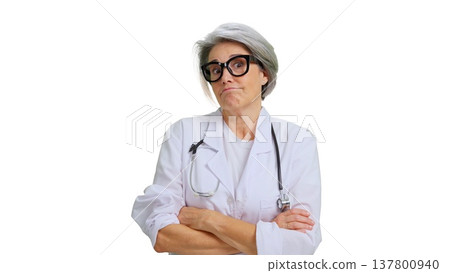 Senior female doctor showing skeptical doubting facial expression Senior female doctor showing skeptical doubting facial expression 137800940